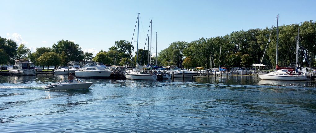 Powerboat motoring into Seneca Lake State Park Marina
