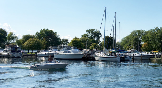 Powerboat motoring into Seneca Lake State Park Marina